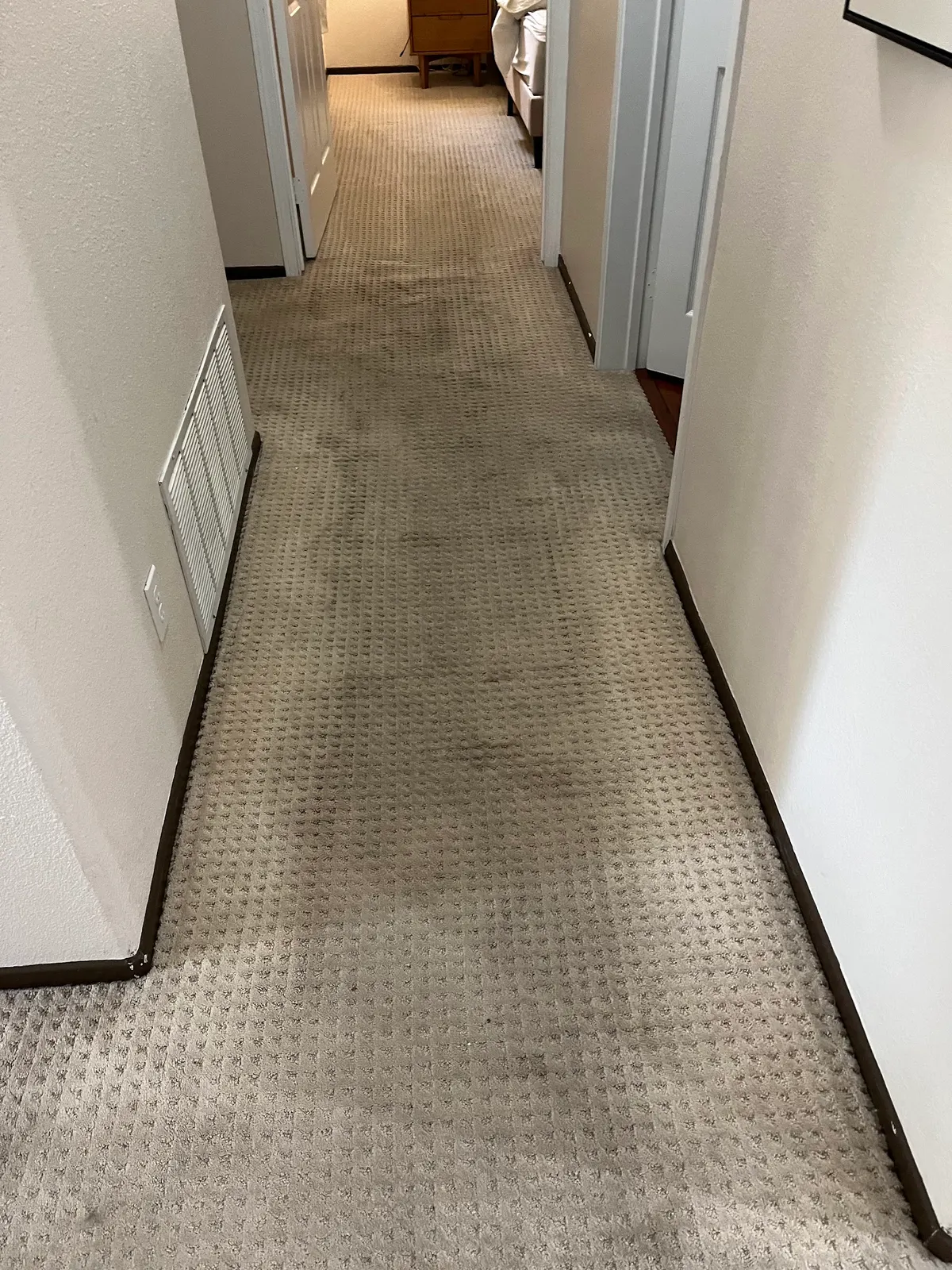 Hallway carpet, a soiled walking lane beside the cleaned hall before cleaning